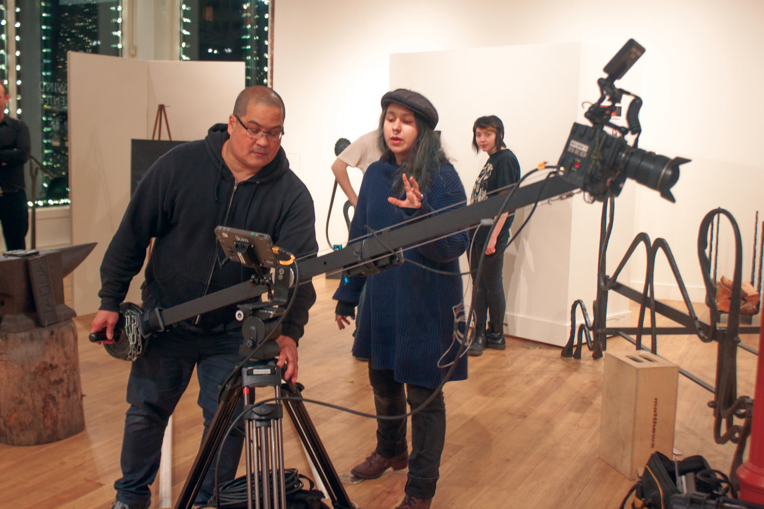 Director of photography Brody Willis (left) receives guidance from “She the Creator” director Juliette Wallace on the positioning of the camera during their Nov. 18 shoot in Northwind Arts Center in Port Townsend.